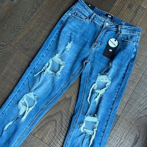 Brand new distressed jean